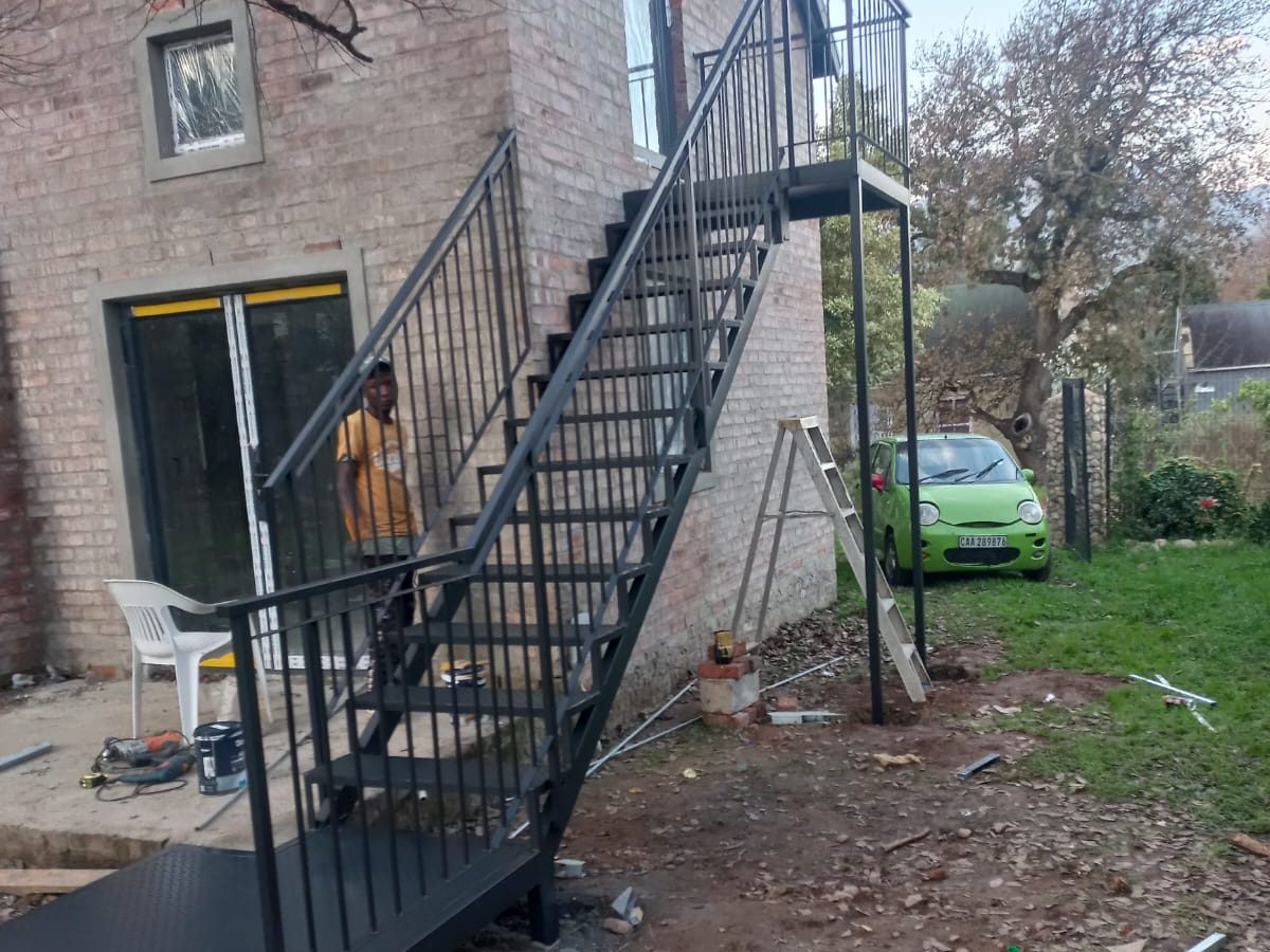 Exterior steel staircase installation by The Classic Forge